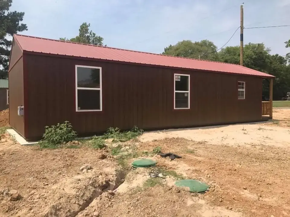 Commercial metal building with a newly installed septic system in front